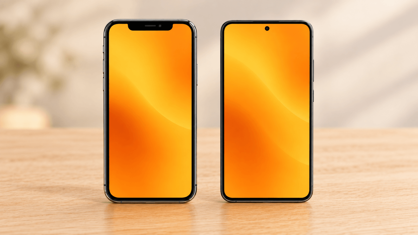 iPhone Xと、より新しいデザインのスマートフォンを並べた机の上